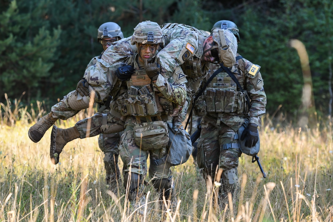 7th Army Training Command team carry a squad member during the U.S ...