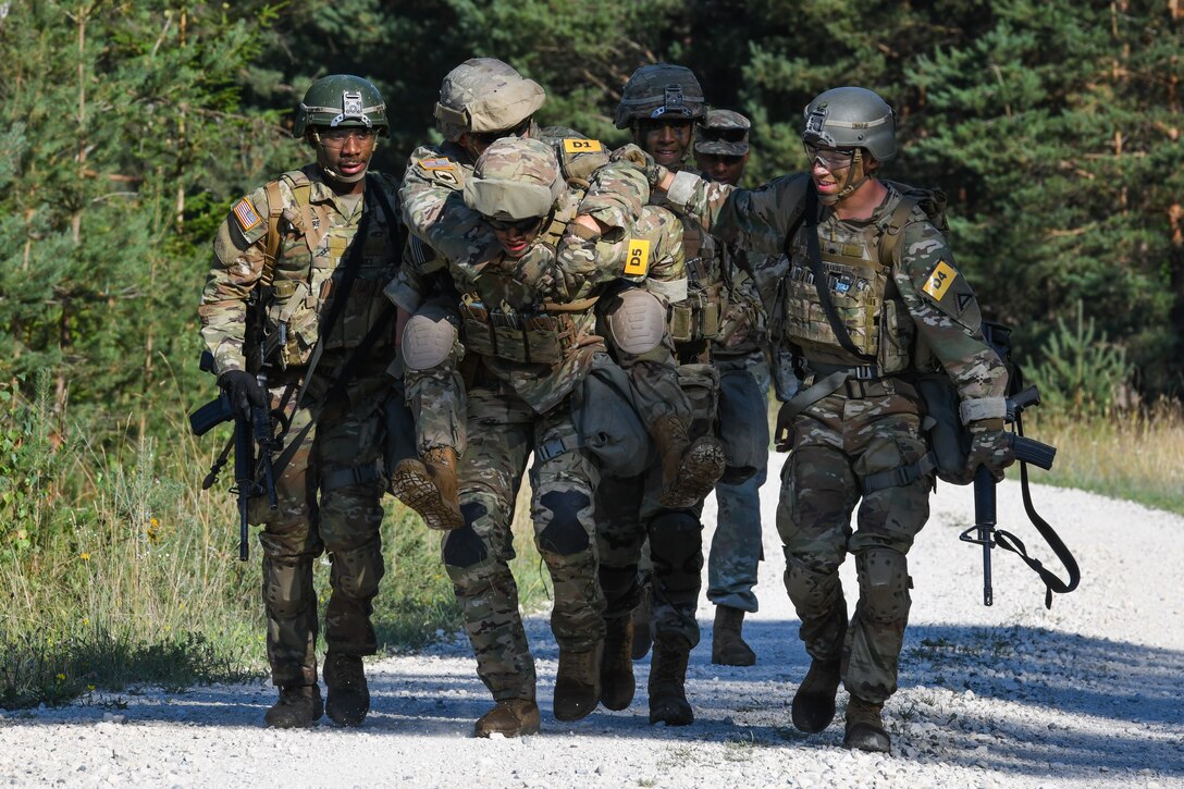 7th Army Training Command team carry a squad member during the U.S ...