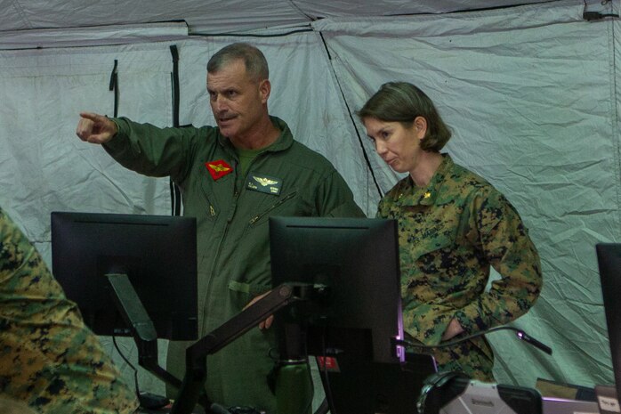 U.S. Marine Corps Maj. Kathleen M. Haggard, tactical air command center company commander, provides updates on Exercise Summer Fury to Maj. Gen. Bradford J. Gering, commanding general of 3rd Marine Aircraft Wing, on Marine Corps Air Station Miramar, California, August 3, 2022. The TACC Company enables wing-level forward deployed aviation command and control and battlespace management across all functions of Marine aviation. Summer Fury 22 is designed to enhance Marine-Air-Ground Task Force integration and increase aviation operations proficiency with realistic, relevant training to ensure the Marine Corps’ largest aircraft wing remains operationally excellent, interoperable, deployable on short notice and lethal when called into action.