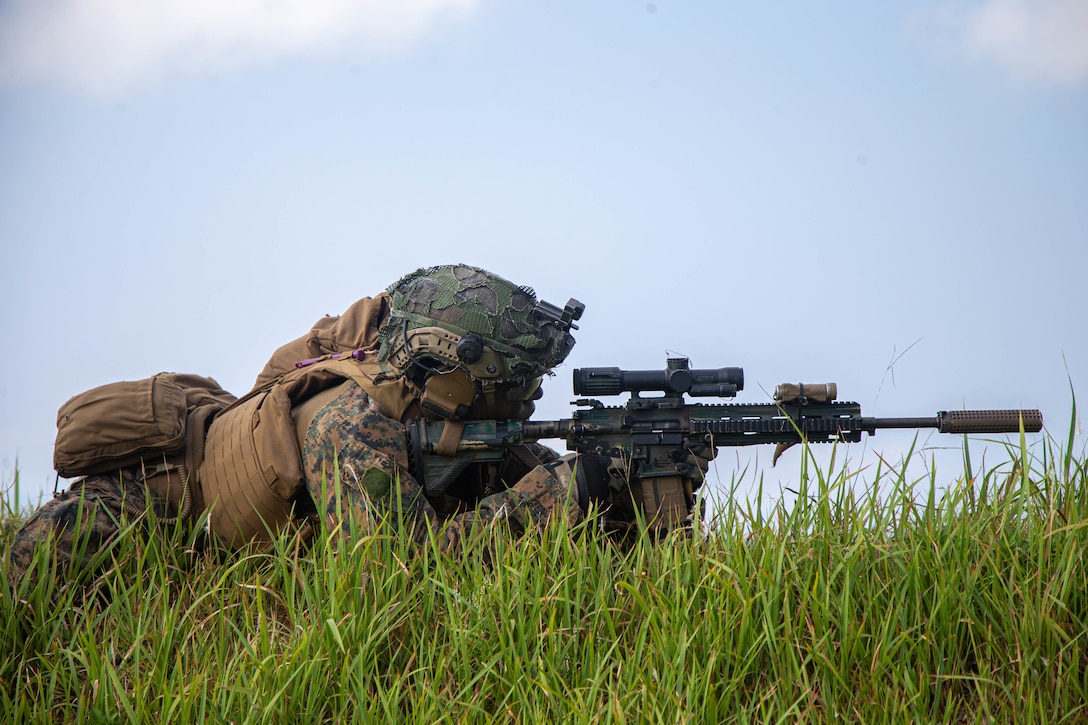 U.S. Marine Corps Lance Cpl. Thomas Porter, a rifleman with 3d Battalion, 2d Marines, fires an M27 infantry automatic rifle while conducting fire team attacks during a Tactical Small Unit Leader Course on Camp Schwab, Okinawa, Japan, July 26, 2022. This training improved the Marines’ proficiency at the tactical level and developed small-unit leadership. 3/2 is forward deployed in the Indo-Pacific under 4th Marines, 3d Marine Division as part of the Unit Deployment Program. Porter is a native of Memphis, Tennessee.