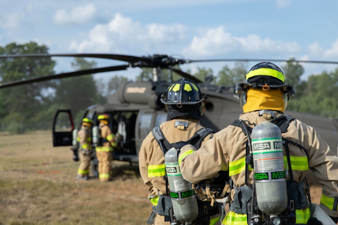 Firefighters from the Camp Grayling Fire Department conduct Pre-Accident Plan Rehearsal training as part of Northern Strike 22 at Grayling Army Airfield, Grayling, Mich., Aug. 6, 2022. Northern Strike is designed to challenge 7,400 service members with multiple forms of training that advance interoperability across multicomponent, multinational and interagency partners. (U.S. Army National Guard photo by Pfc. Erich Holbrook)