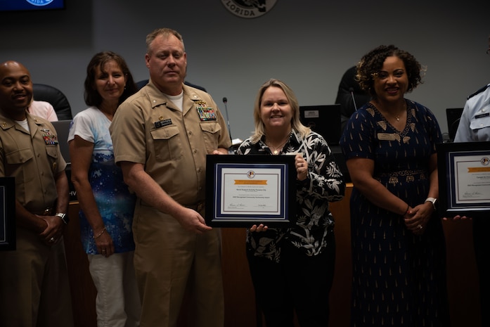 PANAMA CITY, FL- The Naval Support Activity Panama City command team, Cmdr. Keith Foster and CMDCS Duriel Crittenden joined the NSA Panama City's School Liason Officer, Erin Pickard on August 09, to celebrate NSA Panama City, Tyndall Air Force Base, Bay District Schools, and local Charter Schools (Bay Area Education Alliance) winning the “2022 (LTG) Pete Taylor Partnership of Excellence Award.”