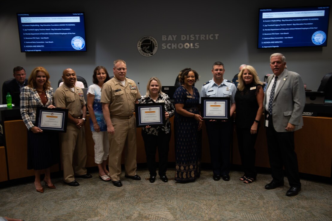 PANAMA CITY, FL- The Naval Support Activity Panama City command team, Cmdr. Keith Foster and CMDCS Duriel Crittenden joined the NSA Panama City's School Liason Officer, Erin Pickard on August 09, to celebrate NSA Panama City, Tyndall Air Force Base, Bay District Schools, and local Charter Schools (Bay Area Education Alliance) winning the “2022 (LTG) Pete Taylor Partnership of Excellence Award.”