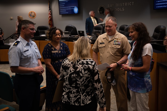 PANAMA CITY, FL- The Naval Support Activity Panama City command team, Cmdr. Keith Foster and CMDCS Duriel Crittenden joined the NSA Panama City's School Liason Officer, Erin Pickard on August 09, to celebrate NSA Panama City, Tyndall Air Force Base, Bay District Schools, and local Charter Schools (Bay Area Education Alliance) winning the “2022 (LTG) Pete Taylor Partnership of Excellence Award.”