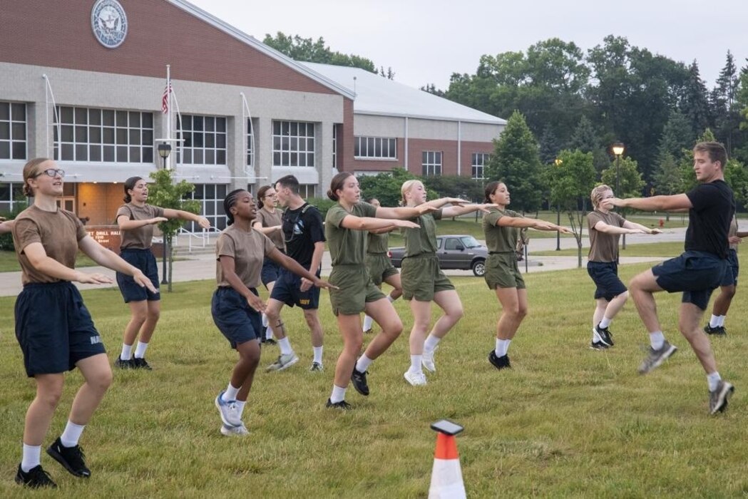 220708-N-ZW825-0345 GREAT LAKES, Ill. (July 8, 2022) Naval Reserve Officers Training Corps (NROTC) New Student Indoctrination (NSI) midshipman candidates perform high knees as part of an endurance course physical training session at Recruit Training Command (RTC), July 8. Upon completion of NSI, the candidates will start their freshman year of the NROTC program at colleges and universities nationwide this fall. NSI is an indoctrination program hosted at RTC, and provides midshipmen with a common military training orientation. NSI provides basic training in five warfighting fundamentals – firefighting, damage control, seamanship, watchstanding and small arms handling and marksmanship – to begin creating basically trained and smartly disciplined future Navy and Marine Corps officers. NROTC is overseen by Commander, Naval Service Training Command (NSTC), Rear Adm. Jennifer S. Couture, which supports naval accessions training for 98 percent of the Navy’s new officers and enlisted Sailors. (U.S. Navy photo by Chief Mass Communication Specialist Byron C. Linder)