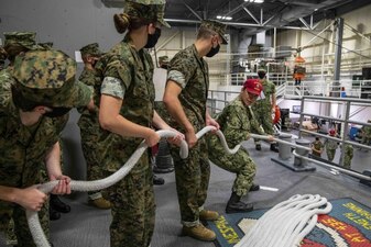 220711-N-PW480-0221 GREAT LAKES, Ill. (July 11, 2022) – Logistics Specialist 2nd Class Hazel Gomez, a seamanship instructor at Recruit Training Command (RTC), gives instruction to Naval Reserve Officer Training Corps (NROTC) New Student Indoctrination (NSI) midshipman candidates prior to conducting line handling aboard the USS Marlinespike trainer at RTC, July 11. Upon completion of NSI, the candidates will start their freshman year of the NROTC program at colleges and universities nationwide this fall. NSI is an indoctrination program hosted at RTC, and provides midshipmen with a common military training orientation. NSI provides basic training in five warfighting fundamentals – firefighting, damage control, seamanship, watchstanding and small arms handling and marksmanship – to begin creating basically trained and smartly disciplined future Navy and Marine Corps officers. NROTC is overseen by Commander, Naval Service Training Command (NSTC), Rear Adm. Jennifer S. Couture, which supports naval accessions training for 98 percent of the Navy’s new officers and enlisted Sailors. (U.S. Navy photo by Mass Communication Specialist 2nd Class Nikita Custer)