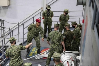 220711-N-PW480-0289 GREAT LAKES, Ill. (July 11, 2022) – Logistics Specialist 2nd Class Hazel Gomez, a seamanship instructor at Recruit Training Command (RTC), gives instruction to Naval Reserve Officer Training Corps (NROTC) New Student Indoctrination (NSI) midshipman candidates prior to conducting line handling aboard the USS Marlinespike trainer at RTC, July 11. Upon completion of NSI, the candidates will start their freshman year of the NROTC program at colleges and universities nationwide this fall. NSI is an indoctrination program hosted at RTC, and provides midshipmen with a common military training orientation. NSI provides basic training in five warfighting fundamentals – firefighting, damage control, seamanship, watchstanding and small arms handling and marksmanship – to begin creating basically trained and smartly disciplined future Navy and Marine Corps officers. NROTC is overseen by Commander, Naval Service Training Command (NSTC), Rear Adm. Jennifer S. Couture, which supports naval accessions training for 98 percent of the Navy’s new officers and enlisted Sailors. (U.S. Navy photo by Mass Communication Specialist 2nd Class Nikita Custer)