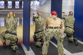 220713-N-ZW825-0690 GREAT LAKES, Ill. (July 13, 2022) Naval Reserve Officers Training Corps (NROTC) New Student Indoctrination (NSI) midshipman candidates conduct a small arms live fire training event at Recruit Training Command (RTC), July 13. Upon completion of NSI, the candidates will start their freshman year of the NROTC program at colleges and universities nationwide this fall. NSI is an indoctrination program hosted at RTC, and provides midshipmen with a common military training orientation. NSI provides basic training in five warfighting fundamentals – firefighting, damage control, seamanship, watchstanding and small arms handling and marksmanship – to begin creating basically trained and smartly disciplined future Navy and Marine Corps officers. NROTC is overseen by Commander, Naval Service Training Command (NSTC), Rear Adm. Jennifer S. Couture, which supports naval accessions training for 98 percent of the Navy’s new officers and enlisted Sailors. (U.S. Navy photo by Chief Mass Communication Specialist Byron C. Linder)