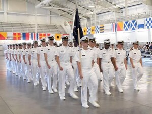 GREAT LAKES, Ill. (July 18, 2022) Naval Reserve Officers Training Corps (NROTC) New Student Indoctrination (NSI) Cycle 2 midshipman candidates march into the Midway Ceremonial Drill Hall at Recruit Training Command (RTC) to commence their graduation ceremony, July 18. Upon completion of NSI, the candidates will start their freshman year of the NROTC program at colleges and universities nationwide this fall. NSI is an indoctrination program hosted at RTC, and provides midshipmen with a common military training orientation. NSI provides basic training in five warfighting fundamentals – firefighting, damage control, seamanship, watchstanding and small arms handling and marksmanship – to begin creating basically trained and smartly disciplined future Navy and Marine Corps officers. NROTC is overseen by Commander, Naval Service Training Command (NSTC), Rear Adm. Jennifer S. Couture, which supports naval accessions training for 98 percent of the Navy’s new officers and enlisted Sailors. (U.S. Navy photo by Scott A. Thornbloom)