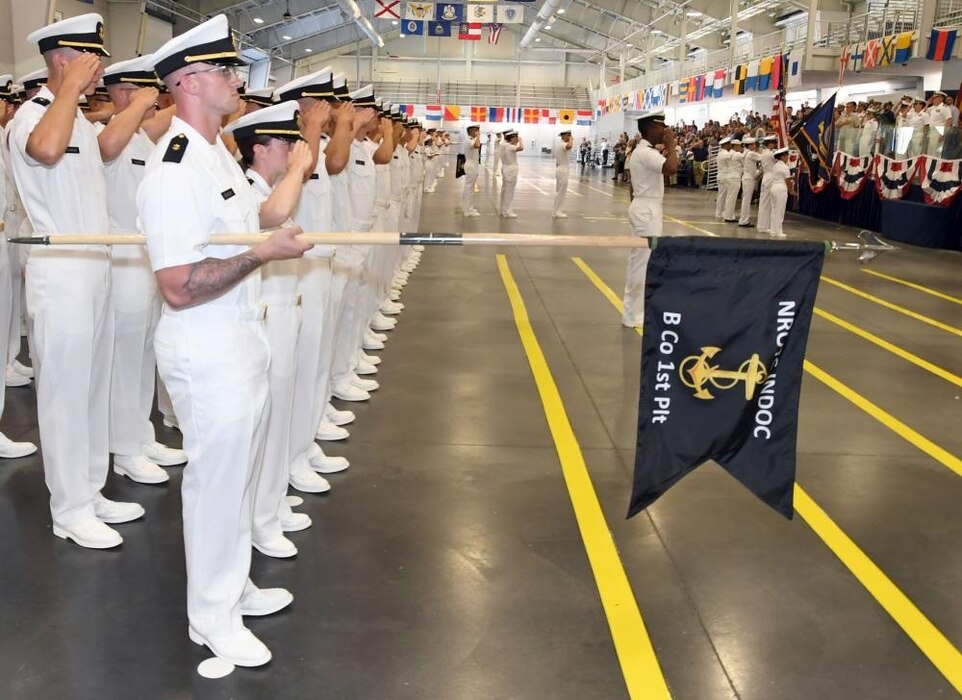 GREAT LAKES, Ill. (July 18, 2022) – Naval Reserve Officers Training Corps (NROTC) New Student Indoctrination (NSI) Cycle 2 midshipman candidates salute during the parading of colors during their graduation ceremony in the Midway Ceremonial Drill Hall at Recruit Training Command (RTC), July 18. Upon completion of NSI, the candidates will start their freshman year of the NROTC program at colleges and universities nationwide this fall. NSI is an indoctrination program hosted at RTC, and provides midshipmen with a common military training orientation. NSI provides basic training in five warfighting fundamentals – firefighting, damage control, seamanship, watchstanding and small arms handling and marksmanship – to begin creating basically trained and smartly disciplined future Navy and Marine Corps officers. NROTC is overseen by Commander, Naval Service Training Command (NSTC), Rear Adm. Jennifer S. Couture, which supports naval accessions training for 98 percent of the Navy’s new officers and enlisted Sailors. (U.S. Navy photo by Scott A. Thornbloom)
