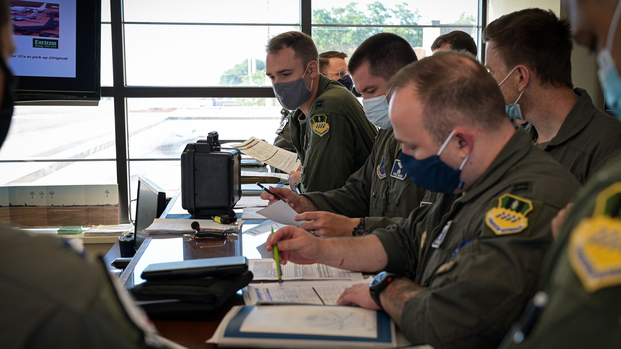 Aircrew from the 20th Bomb Squadron attend a pre-flight brief at the Integrated Operations Center in support RIMPAC 2022 at Barksdale Air Force Base, Aug. 1, 2022. Twenty-six nations, 38 ships, three submarines, more than 170 aircraft and 25,000 personnel are participating in RIMPAC from June 29 to Aug. 4 in and around the Hawaiian Islands and Southern California. The world’s largest international maritime exercise, RIMPAC provides a unique training opportunity while fostering and sustaining cooperative relationships among participants critical to ensuring the safety of sea lanes and security on the world’s oceans. RIMPAC 2022 is the 28th exercise in the series that began in 1971. (U.S. Air Force photo by Senior Airman Jonathan E. Ramos)