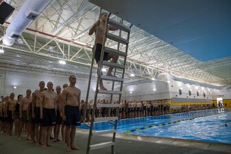 220725-N-ZW825-0032 GREAT LAKES, Ill. (July 25, 2022) Naval Reserve Officers Training Corps (NROTC) New Student Indoctrination (NSI) Cycle 3 midshipman candidates ascend the dive platform ladder to commence their third-class swimming qualification at Recruit Training Command (RTC), July 25. Upon completion of NSI, the candidates will start their freshman year of the NROTC program at colleges and universities nationwide this fall. NSI is an indoctrination program hosted at RTC, and provides midshipmen with a common military training orientation. NSI provides basic training in five warfighting fundamentals – firefighting, damage control, seamanship, watchstanding and small arms handling and marksmanship – to begin creating basically trained and smartly disciplined future Navy and Marine Corps officers. NROTC is overseen by Commander, Naval Service Training Command (NSTC), Rear Adm. Jennifer S. Couture, which supports naval accessions training for 98 percent of the Navy’s new officers and enlisted Sailors. (U.S. Navy photo by Chief Mass Communication Specialist Byron C. Linder)