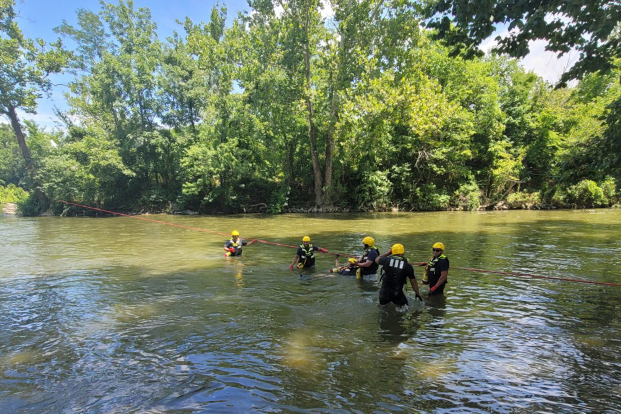 Firefighters assigned to the 167th Civil Engineering Squadron participate in swift water rescue training in Jefferson County, West Virginia, July 21, 2022. The Airmen learned how to operate rescue boats, navigate currents and apply rope saving techniques to rescue victims.
