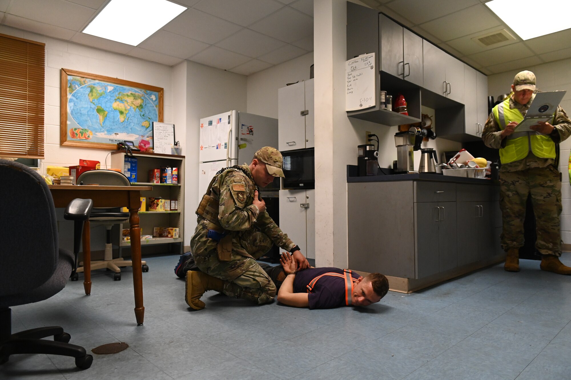 U.S. Air Force Staff Sgt. Colton Brandenburg, 167th Security Forces Squadron, simulates use of force during an active shooter training event held at the 167th Airlift Wing, Martinsburg, West Virginia, Aug. 7, 2022.