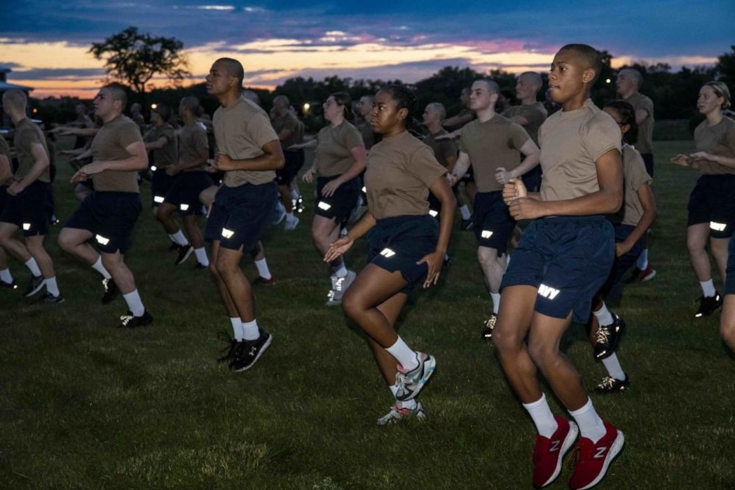 220726-N-PW480-0072 220726-N-PW480-0155 GREAT LAKES, Ill. (July 26, 2022) Naval Reserve Officers Training Corps (NROTC) New Student Indoctrination (NSI) 2022 Cycle 3 midshipman candidates perform a high knee warm-up exercise during an inventory physical readiness test at Recruit Training Command (RTC), July 26. Upon completion of NSI, the candidates will start their freshman year of the NROTC program at colleges and universities nationwide this fall. NSI is an indoctrination program hosted at RTC, and provides midshipmen with a common military training orientation. NSI provides basic training in five warfighting fundamentals – firefighting, damage control, seamanship, watchstanding and small arms handling and marksmanship – to begin creating basically trained and smartly disciplined future Navy and Marine Corps officers. NROTC is overseen by Commander, Naval Service Training Command (NSTC), Rear Adm. Jennifer S. Couture, which supports naval accessions training for 98 percent of the Navy’s new officers and enlisted Sailors. (U.S. Navy photo by Mass Communication Specialist 2nd Class Nikita Custer)