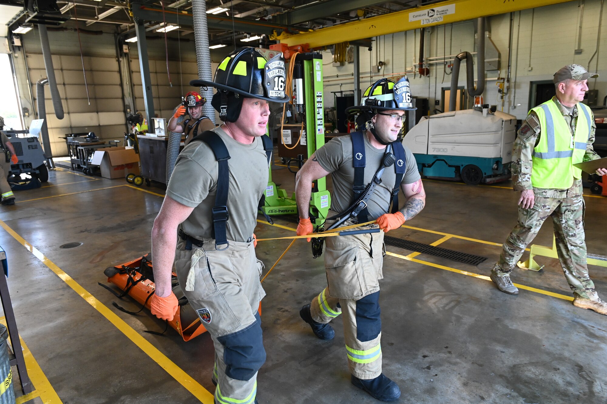 U.S. Air Force Staff Sgt. Jason Mitchell and Staff Sgt. Cody Miller, firefighters with the 167th Civil Engineering Squadron transport a simulated victim of an active shooter during a training scenario at the 167th Airlift Wing, Martinsburg, West Virginia, Aug. 7, 2022. The simulated victims wear a tag to communicate their conditions to first responders when they arrive.