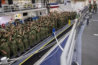 220727-N-ZW825-0087 GREAT LAKES, Ill. (July 27, 2022) Naval Reserve Officers Training Corps (NROTC) New Student Indoctrination (NSI) Cycle 3 midshipman candidates demonstrate the signal for a training time-out prior to boarding the USS Marlinespike seamanship trainer at Recruit Training Command (RTC), July 27. Upon completion of NSI, the candidates will start their freshman year of the NROTC program at colleges and universities nationwide this fall. NSI is an indoctrination program hosted at RTC, and provides midshipmen with a common military training orientation. NSI provides basic training in five warfighting fundamentals – firefighting, damage control, seamanship, watchstanding and small arms handling and marksmanship – to begin creating basically trained and smartly disciplined future Navy and Marine Corps officers. NROTC is overseen by Commander, Naval Service Training Command (NSTC), Rear Adm. Jennifer S. Couture, which supports naval accessions training for 98 percent of the Navy’s new officers and enlisted Sailors. (U.S. Navy photo by Chief Mass Communication Specialist Byron C. Linder)