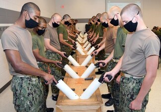 220801-N-IK959-3236 GREAT LAKES, Ill. (August 01, 2022) Naval Reserve Officers Training Corps (NROTC) New Student Indoctrination (NSI) midshipman candidates learn how to verify their Berretta 9mm weapons are clear during a small arms training event at Recruit Training Command (RTC), August 1. Upon completion of NSI, the candidates will start their freshman year of the NROTC program at colleges and universities nationwide this fall. NSI is an indoctrination program hosted at RTC, and provides midshipmen with a common military training orientation. NSI provides basic training in five warfighting fundamentals – firefighting, damage control, seamanship, watchstanding and small arms handling and marksmanship – to begin creating basically trained and smartly disciplined future Navy and Marine Corps officers. NROTC is overseen by Commander, Naval Service Training Command (NSTC), Rear Adm. Jennifer S. Couture, which supports naval accessions training for 98 percent of the Navy’s new officers and enlisted Sailors. (U.S. Navy photo by Scott A. Thornbloom)