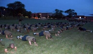 220803-N-IK959-3632 GREAT LAKES, Ill. (August 3, 2022) Naval Reserve Officers Training Corps (NROTC) New Student Indoctrination (NSI) midshipman candidates participate in morning physical training at Recruit Training Command (RTC), August 3. Upon completion of NSI, the candidates will start their freshman year of the NROTC program at colleges and universities nationwide this fall. NSI is an indoctrination program hosted at RTC, and provides midshipmen with a common military training orientation. NSI provides basic training in five warfighting fundamentals – firefighting, damage control, seamanship, watchstanding and small arms handling and marksmanship – to begin creating basically trained and smartly disciplined future Navy and Marine Corps officers. NROTC is overseen by Commander, Naval Service Training Command (NSTC), Rear Adm. Jennifer S. Couture, which supports naval accessions training for 98 percent of the Navy’s new officers and enlisted Sailors. (U.S. Navy photo by Scott A. Thornbloom)