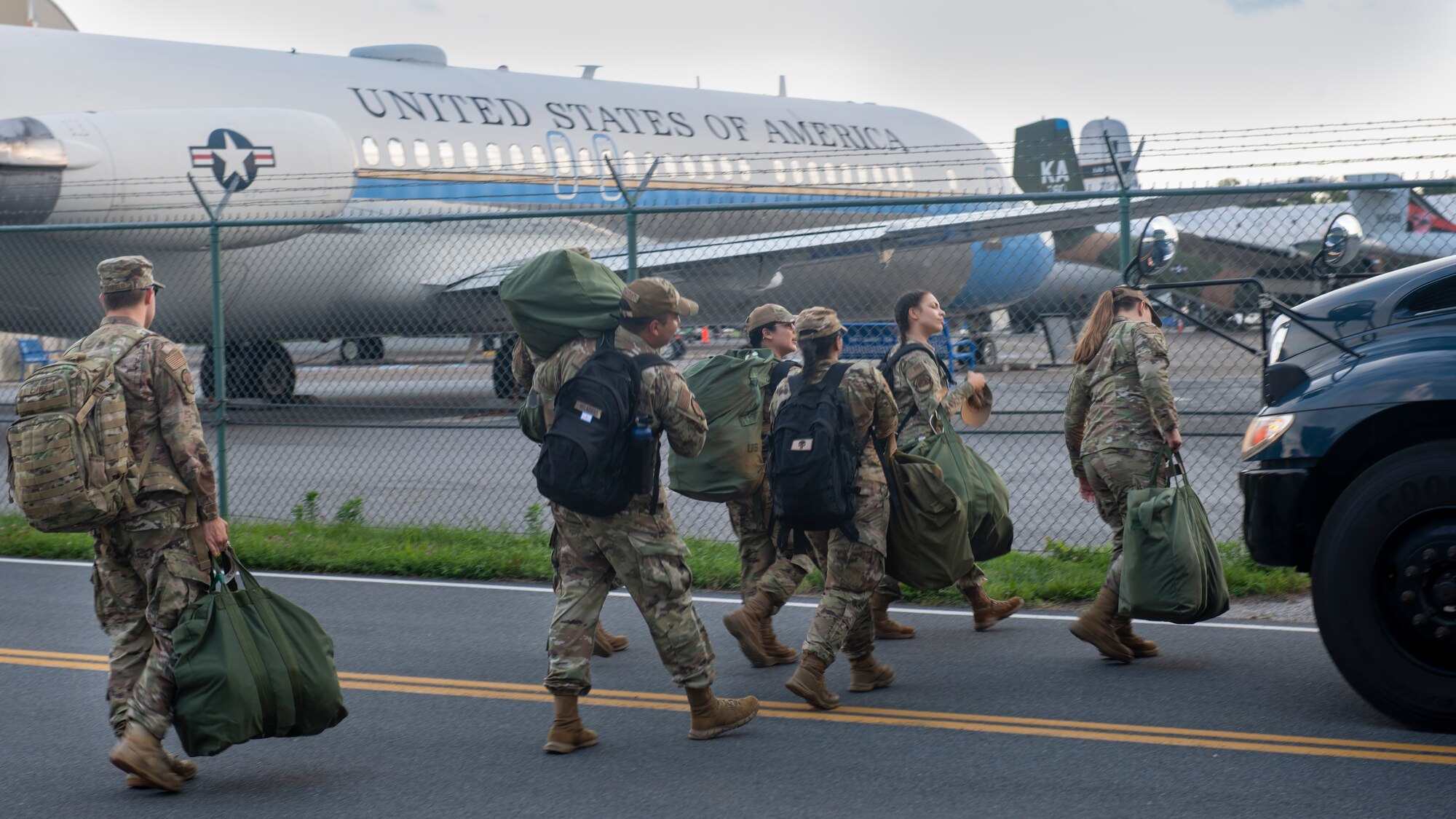 Members from the 512th and 436th airlift wings carry equipment onto a bus during the Liberty Eagle Readiness Exercise at Dover Air Force Base, Delaware, July 12, 2022. Members from both wings participated in a simulated deployment to a forward operating base, located on Dover AFB, July 11-15, 2022. The purpose of this exercise was to validate the 512th and 436th airlift wings' ability to generate, employ and sustain airpower across the world in a contested and degraded operational environment. (U.S. Air Force photo by Senior Airman Shayna Hodge)