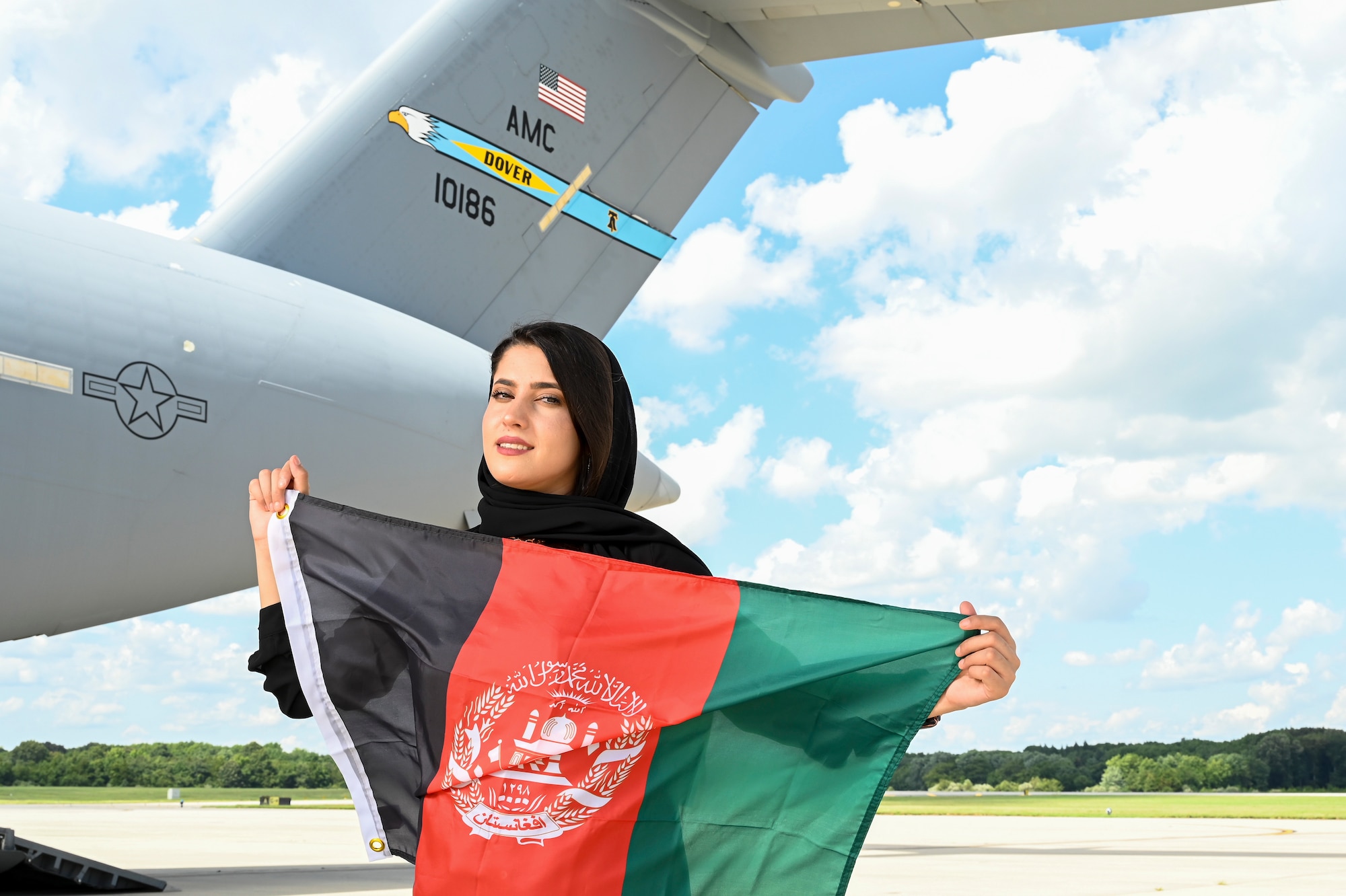 Zarafshan “Zaro” Mirzaie, an Afghan evacuee, revisits the same C-17 Globemaster III that carried her to the U.S., reflecting on the one year anniversary of Operation Allies Refuge at Dover Air Force Base, Delaware, Aug. 8, 2022. Zaro flew out of Afghanistan in August 2021, and was the 2,311th Afghan to arrive at Task Force Liberty on Joint Base McGuire-Dix-Lakehurst, New Jersey, during Operation Allies Welcome. (U.S. Air Force photo by Senior Airman Stephani Barge)