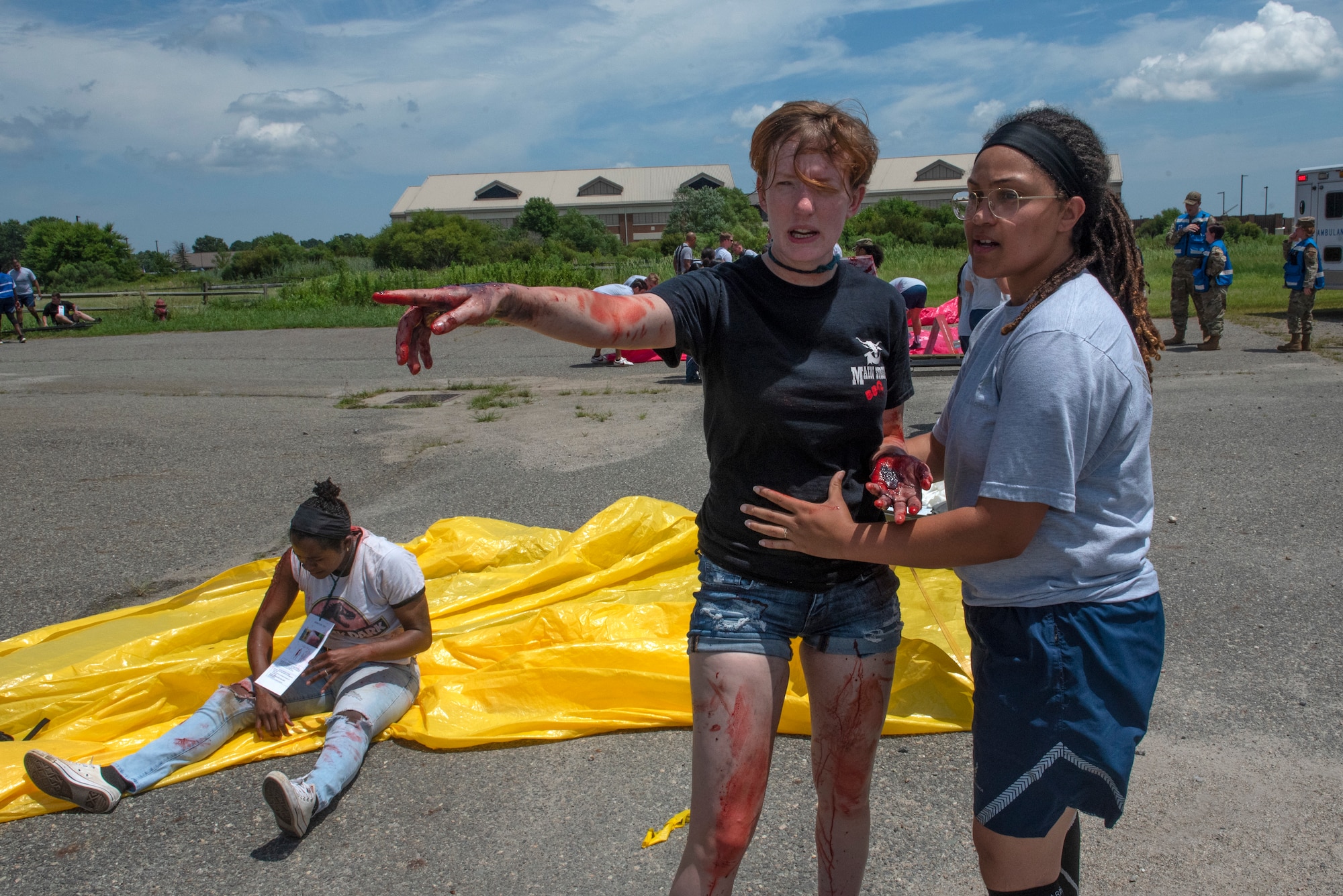 Staff Sgt. Emoni Covington, 633d Surgical Operations Squadron non-commissioned officer in charge, assists Senior Airman Elizabeth Bennet, 1st Munitions Squadron precision guided munitions technician, during the 633d Medical Group’s Comprehensive Medical Readiness Training exercise at Joint Base Langley-Eustis, Virginia, July 28, 2022.