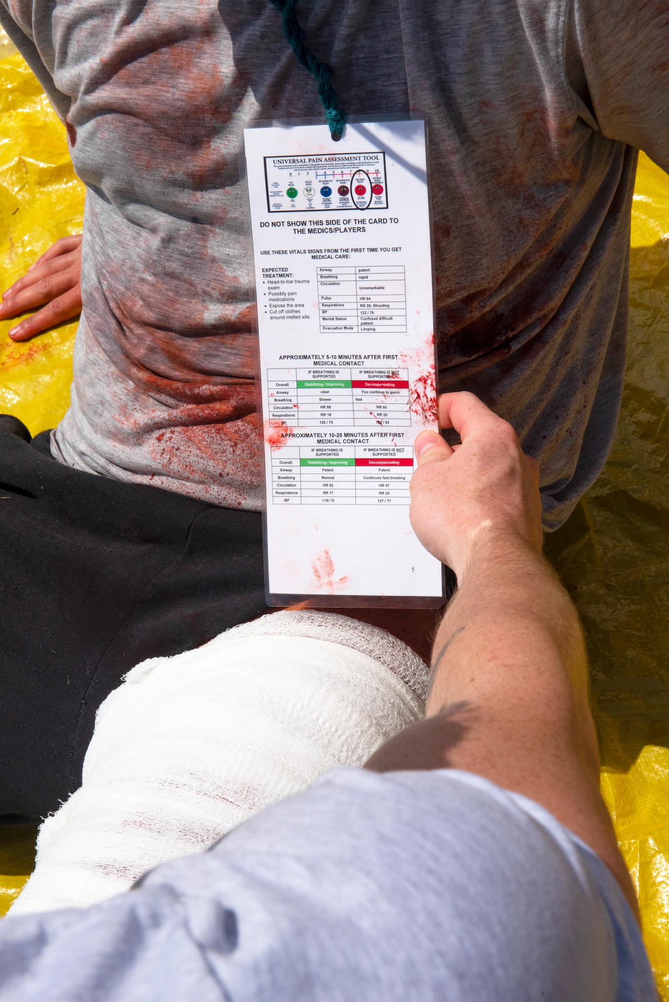 A 633d Medical Group member, reviews the health chart of a moulage patient during a 633d MDG Comprehensive Medical Readiness Training exercise at Joint Base Langley-Eustis, Virginia, July 28, 2022.