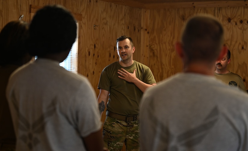 U.S. Air Force Maj. Matthew Nemero, 633d Healthcare Operations Squadron Internal Medicine physician, briefs a group of medical Airmen during the Comprehensive Medical Readiness Training exercise at Joint Base Langley-Eustis, Virginia, July 28, 2022.