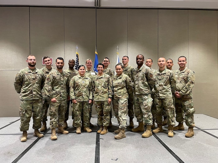 60 international Airmen posing for a photo