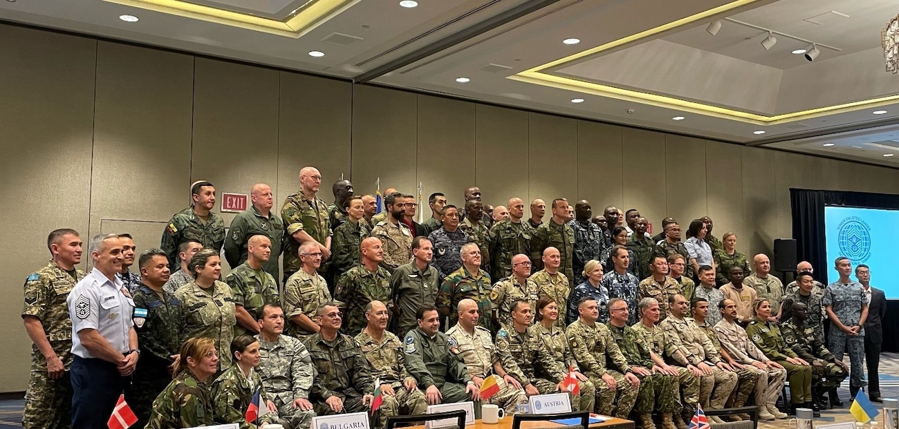 60 international Airmen posing for a photo