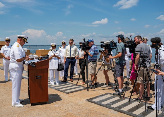 Rear Adm. Dennis Velez, commander, Carrier Strike Group (CSG) 10 and the George H.W. Bush CSG, delivers remark during a press conference as the ship prepares to depart Naval Station Norfolk for a scheduled deployment, Aug. 10, 2022. The George H.W. Bush Carrier Strike Group (CSG) is an integrated combat weapons system that delivers superior combat capability to deter, and if necessary, defeat America’s adversaries in support of national security.