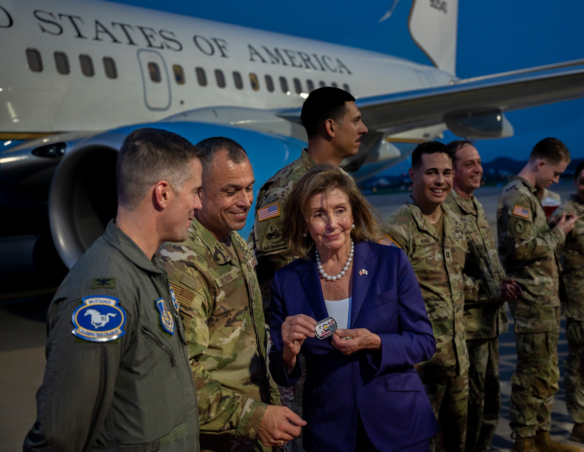 Nancy Pelosi, Speaker of the U.S. House of Representatives, Col. Joshua Wood, 51st Fighter Wing commander and Chief Master Sgt. John Alsvig, 51st Fighter Wing, command chief, pose for a photo at Osan Air Base, Republic of Korea, Aug. 4, 2022.