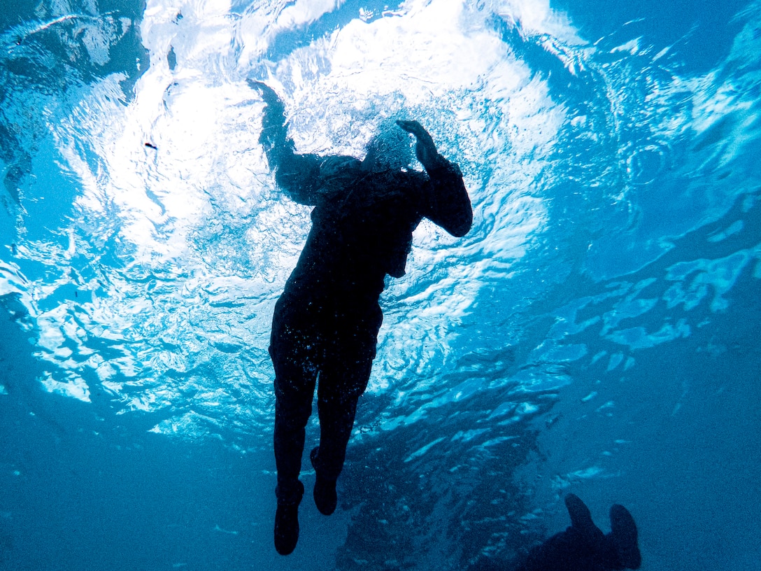 A U.S. Marine participating in the Water Survival Advanced course conducts an endurance swim during the WSA course on Marine Corps Air Station Futenma, Okinawa, Japan, July 21, 2022. WSA is the highest swim qualification that Marines can obtain before becoming Marine Corps Instructors of Water Survival. Throughout the course, students endured aquatic conditioning, endurance swimming, and underwater rescue training. (U.S. Marine Corps photo by Lance Cpl. Thomas Sheng)