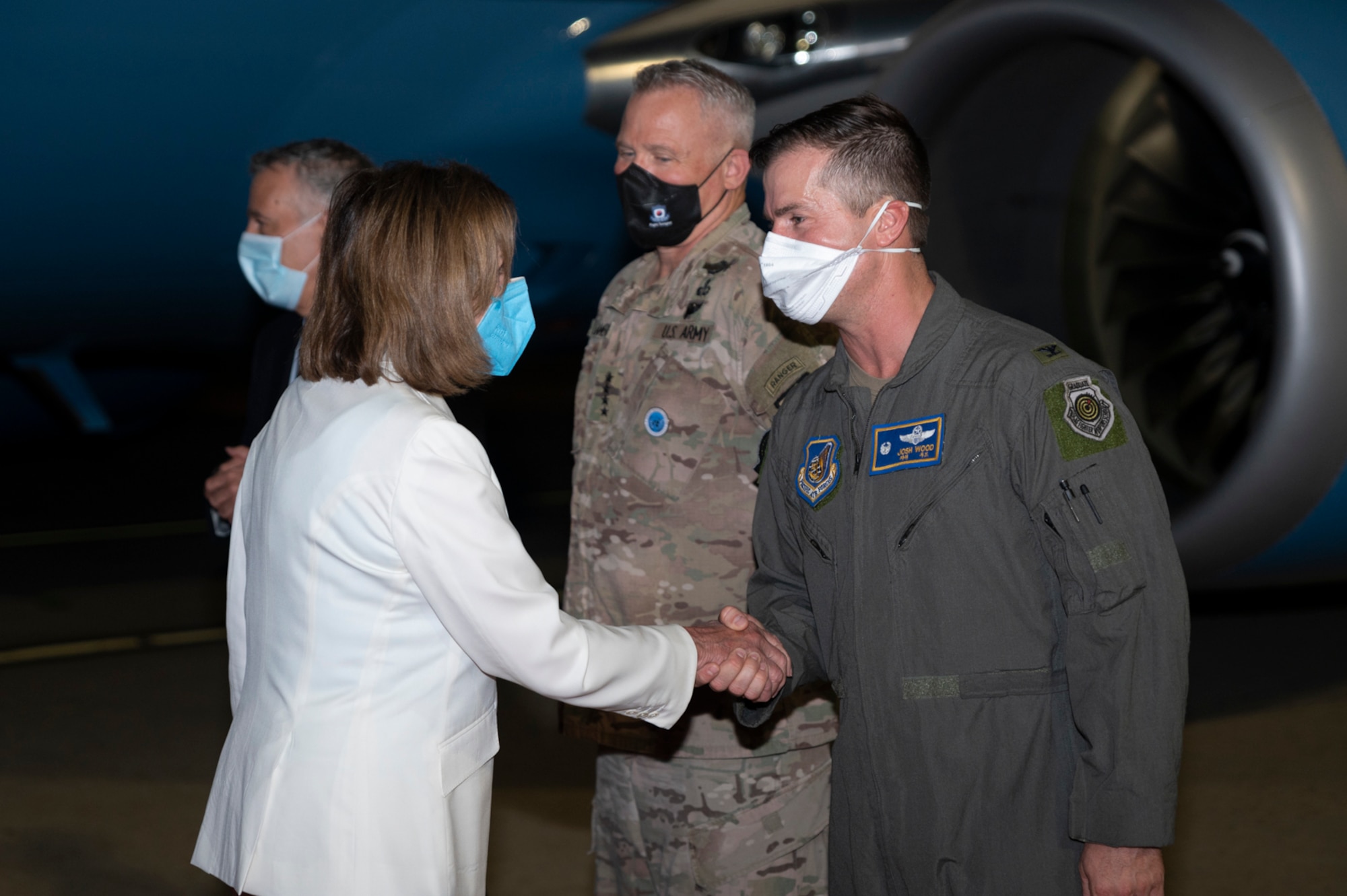 Nancy Pelosi, speaker of the U.S. House of Representatives, shakes hands with U.S. Air Force Colonel Joshua Wood, 51st Fighter Wing Commander, at Osan Air Base, Republic of Korea, Aug 3, 2022.