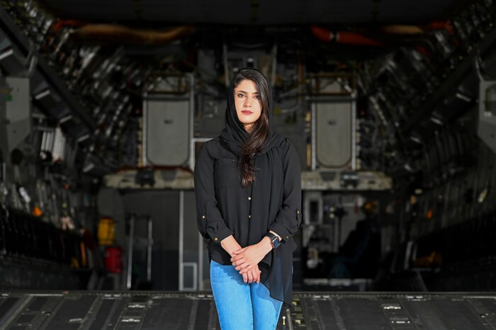 Zarafshan “Zaro” Mirzaie, an Afghan evacuee, revisits the same C-17 Globemaster III that carried her to the U.S., reflecting on the one year anniversary of Operation Allies Refuge at Dover Air Force Base, Delaware, Aug. 8, 2022. Zaro flew out of Afghanistan in August 2021, and was the 2,311th Afghan to arrive at Task Force Liberty on Joint Base McGuire-Dix-Lakehurst, New Jersey, during Operation Allies Welcome. (U.S. Air Force photo by Senior Airman Stephani Barge)