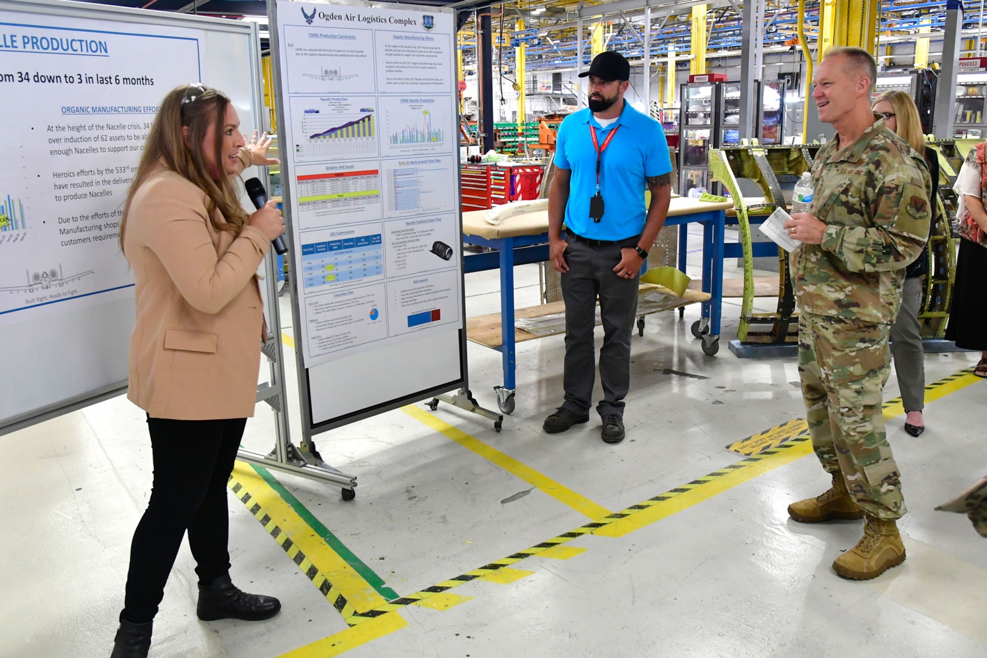 Alexis Berry (left), 533rd Commodities Maintenance Squadron, briefs Gen. Mark D. Kelly, Air Combat Command commander.