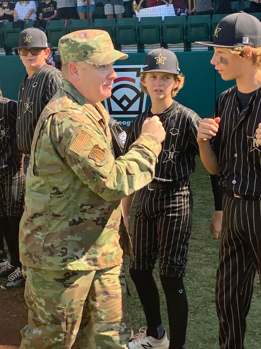 Chief Master Sgt. Darren Wiseman, Air Force Reserve Command's Force Generation Senior Enlisted Leader, participates in the Southeast Region Little League Baseball tournament military appreciation pregame ceremony on August 7, in Warner Robins, Georgia.