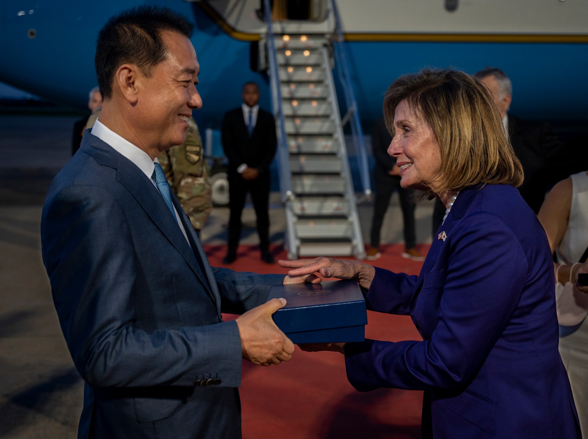 Nancy Pelosi, Speaker of the U.S. House of Representatives, presents a memento to Gwang-jae Lee, Secretary of the National Assembly of the Republic of Korea, at Osan Air Base, Republic of Korea, Aug 3, 2022.