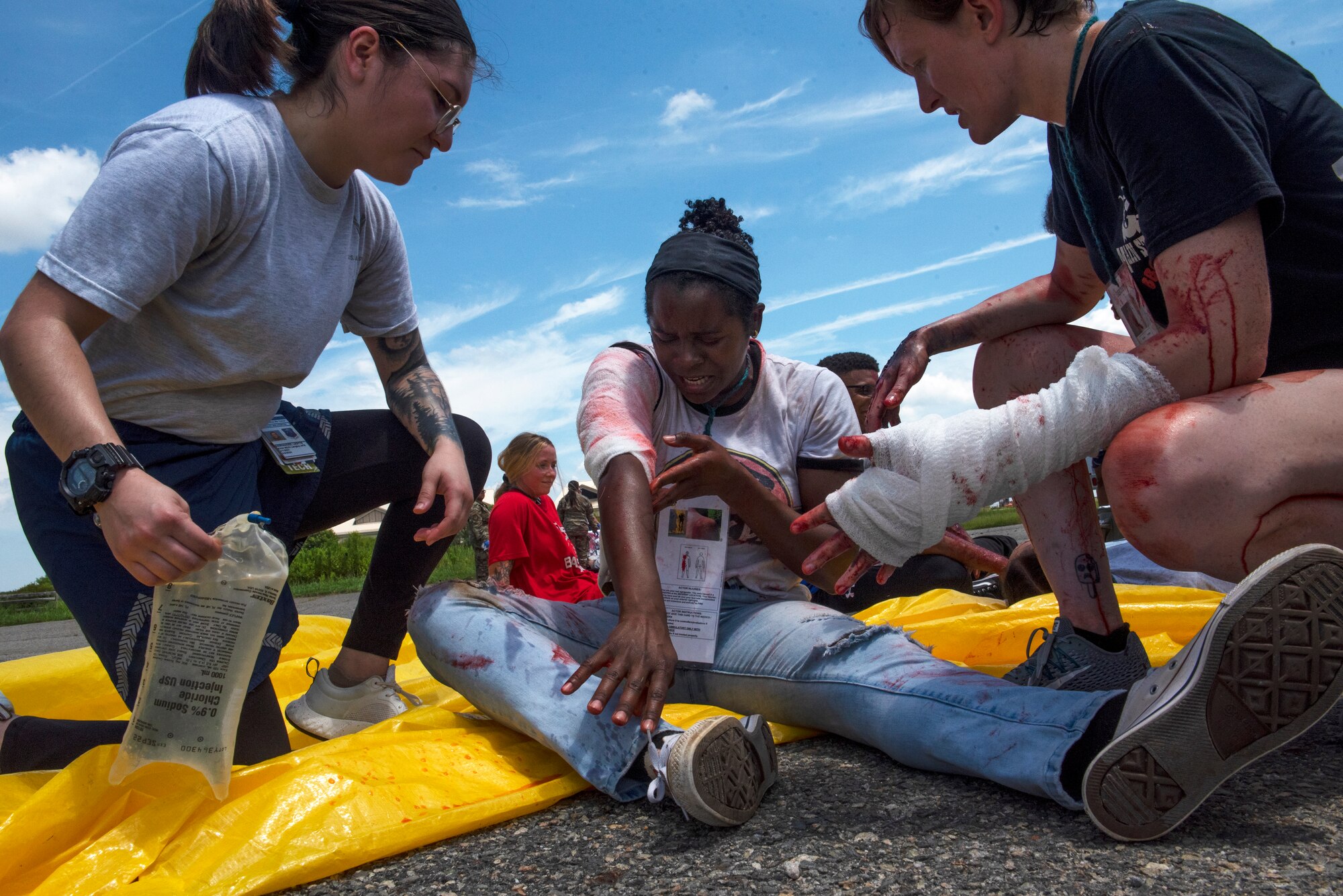 U.S. Air Force Senior Airman Lisette Hernandez, 633d Operational Medicine Readiness Squadron medical technician, treats a moulage patient during a 633d Medical Group training exercise at Joint Base Langley-Eustis, Virginia, July 28, 2022.