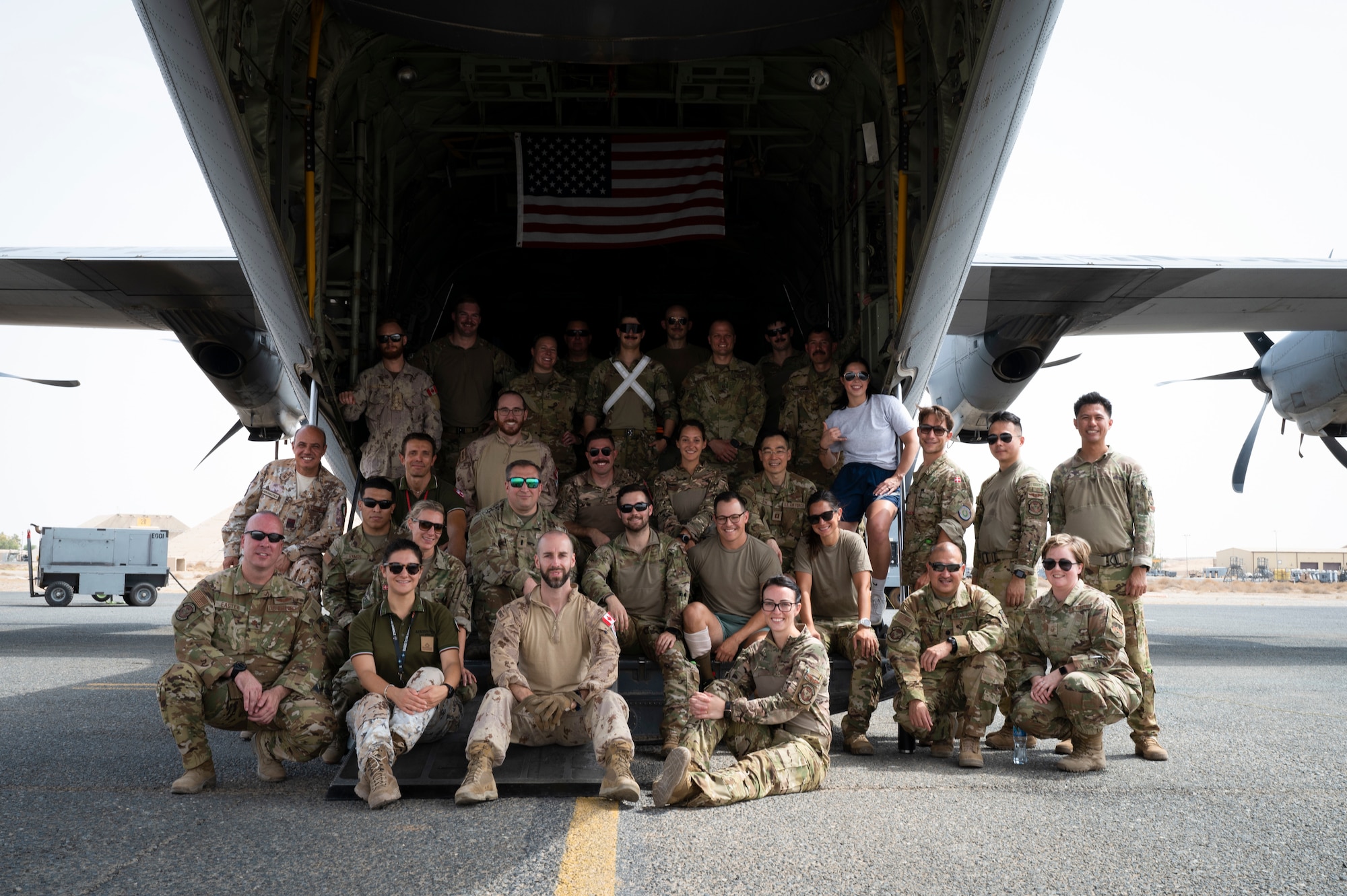Military personnel from the U.S. Air Force, Canadian Armed Forces, Royal Danish Army and the Italian Air Force conducted medical evacuation training on a C-130J Super Hercules aircraft at Ali Al Salem Air Base, Kuwait, July 29, 2022. The training provided valuable insight to help increase the speed wounded service members can be moved to higher echelon of care while also improving safety of medical members and patients. (U.S. Air Force photo by Staff Sgt. Dalton Williams)