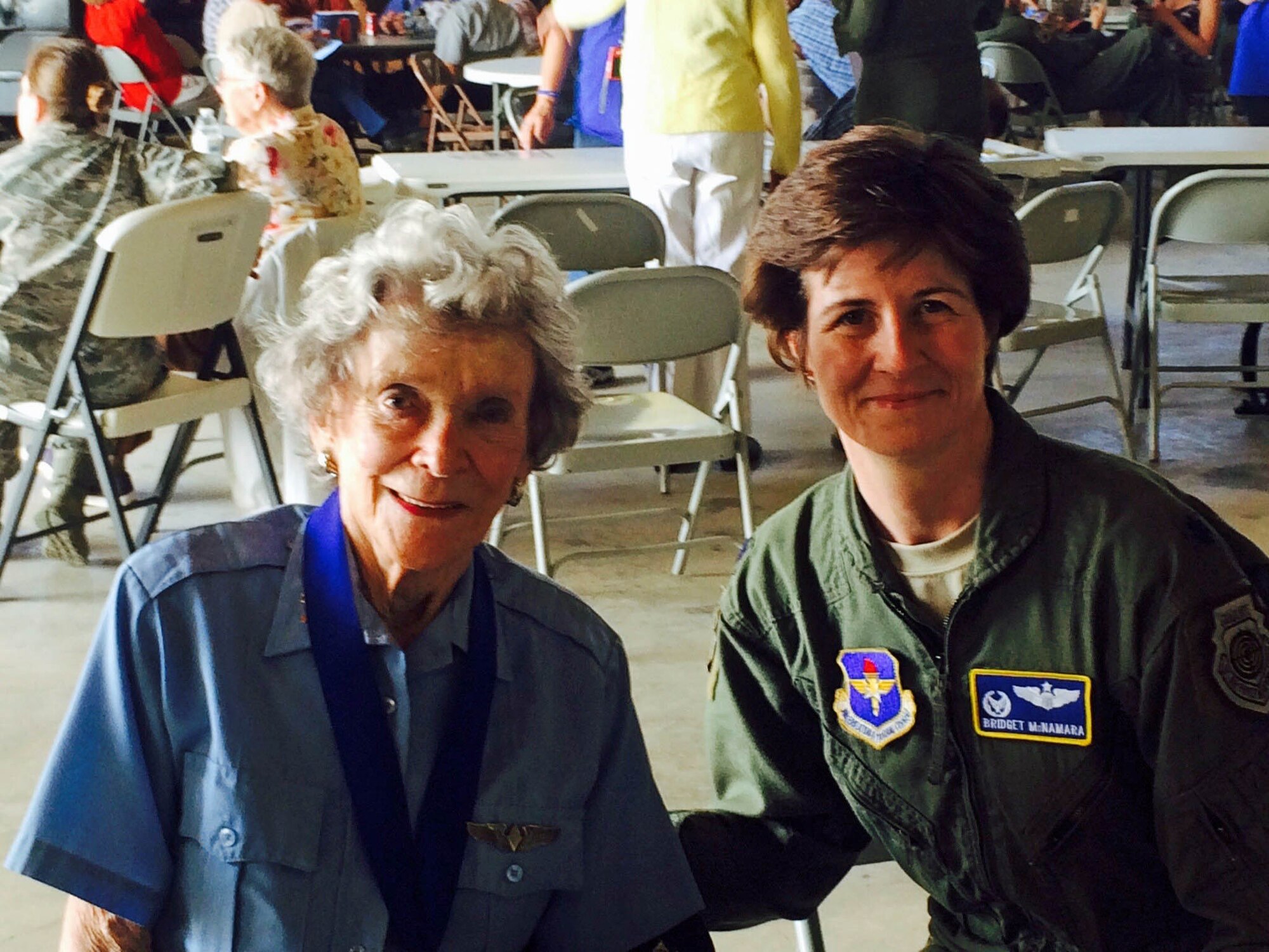 Womens Air Force Service Pilot (WASP) Bee Haydu shares stories with now 8th Air Force vice commander Col. Bridget McNamara, right, in Sweetwater, Texas.