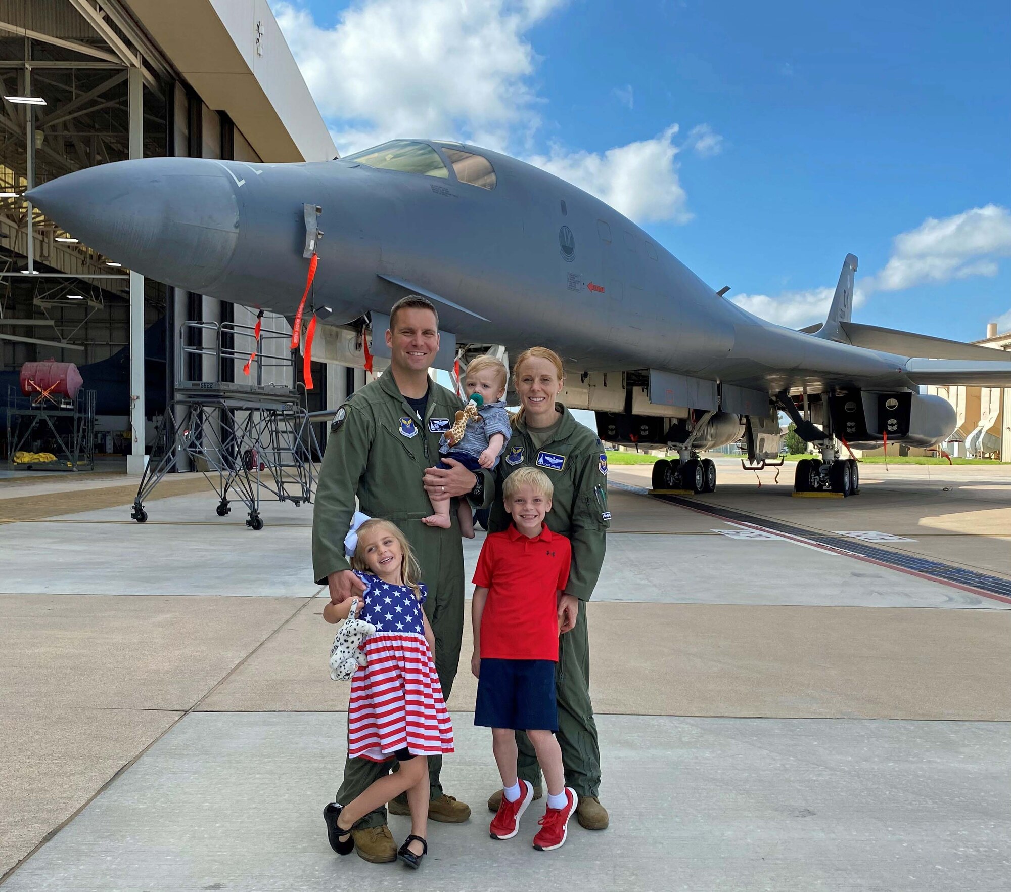 Lt. Col. Kristen Jenkins, right, 28th Bomb Squadron commander, stand with her family at Dyess AFB, Texas.