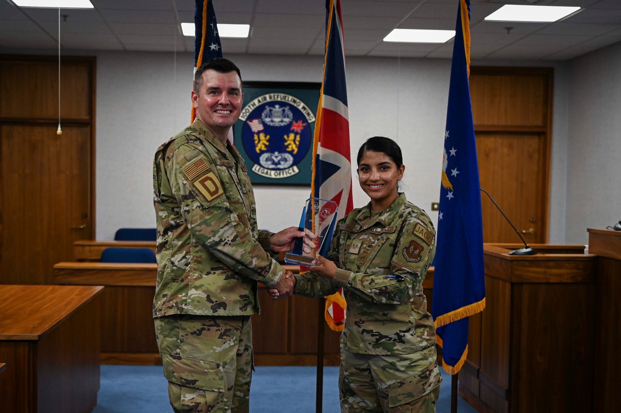 U.S. Air Force Col. Gene Jacobus, 100th Air Refueling Wing commander, presented the 100th ARW Wing Office of the Staff Judge Advocate with the United States Air Forces in Europe – Air Forces Africa Judge Advocate General Corps’ Legal Office of the year award. The 100th ARW Wing Office of the Staff Judge Advocate is well-known throughout the JAG Corps for their effective and timely handling of legal cases. (U.S. Air Force photo by Airman 1st Class Viviam Chiu)