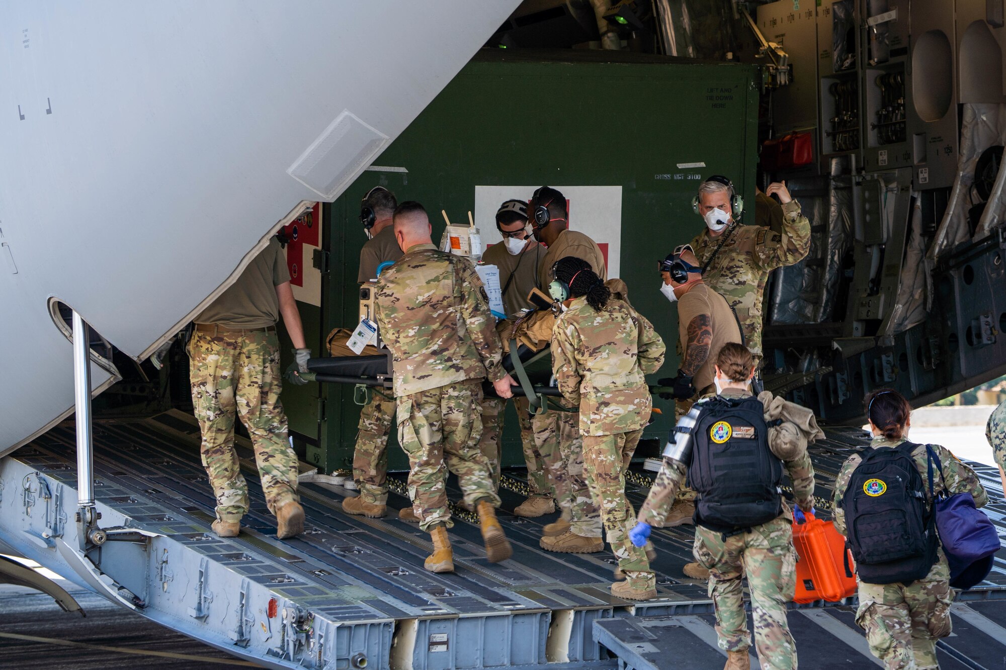 Airmen assigned to the 15th Medical Group,
En Route Patient Staging Element load a
patient onto a C-17 Globemaster III during an
Aeromedical Evacuation Mission at Joint
Base Pearl Harbor-Hickam, Hawaii, July 27,
2022. Airmen are prepared to administer life-
saving medical care to patients while in the
air. (U.S. Air Force photo
by Senior Airman Makensie Cooper)