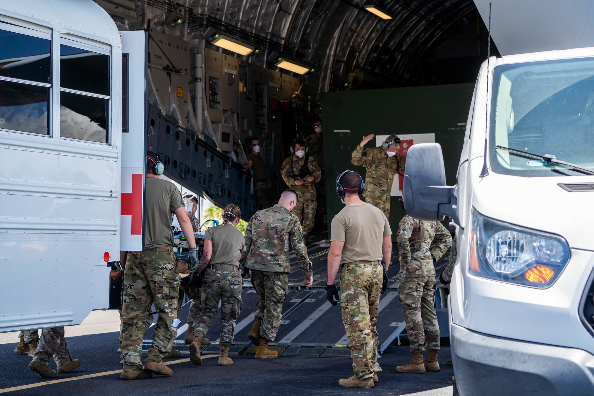 Hickam Airmen work alongside
Airmen from Travis Air Force Base,
California, and Joint Base San
Antonio, Texas, to transport a patient
onto a C-17 Globemaster III during
an Aeromedical Evacuation Mission at
Joint Base Pearl Harbor-Hickam, July
27, 2022. Airmen are prepared to
administer life-saving medical care to
patients while in the air flying to a
medical center. (U.S. Air Force photo by Senior Airman Makensie Cooper)