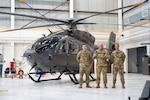 (From left) U.S. Army Instructor Pilot and Colorado Hoist Rescue Team Program Manager Chief Warrant Officer 3 Clayton Horney, State Army Aviation Officer Col. William Gentle, and Army Aviation State Facility Commander Maj. Chris Moskoff  stand in front of the Colorado Army National Guard's new UH-72B Lakota helicopter, Buckley Space Force Base, Aurora, Colorado, Aug. 10, 2022. The COARNG received the first two of 18 UH-72B Lakota helicopters purchased by the Department of Defense exclusively for the U.S. Army National Guard. Nine states will receive two each of the B models based on their previous UH-72A utilization, domestic support mission sets, and environmental factors. (U.S. Army National Guard photo by Capt. Remington Henderson)