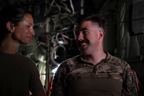 From left. U.S. Air Force Capt. Leah Kirkland, 405th Expeditionary Aeromedical Evacuation Squadron flight nurse, and Staff Sgt. Frank Schaffer, 405th EAES aeromedical evacuation technician, share a moment during a coalition training exercise at Ali Al Salem Air Base, Kuwait, July 29, 2022. The training provided valuable insight to help increase the speed wounded service members can be moved to higher echelon of care while also improving safety of medical members and patients. (U.S. Air Force photo by Staff Sgt. Dalton Williams)