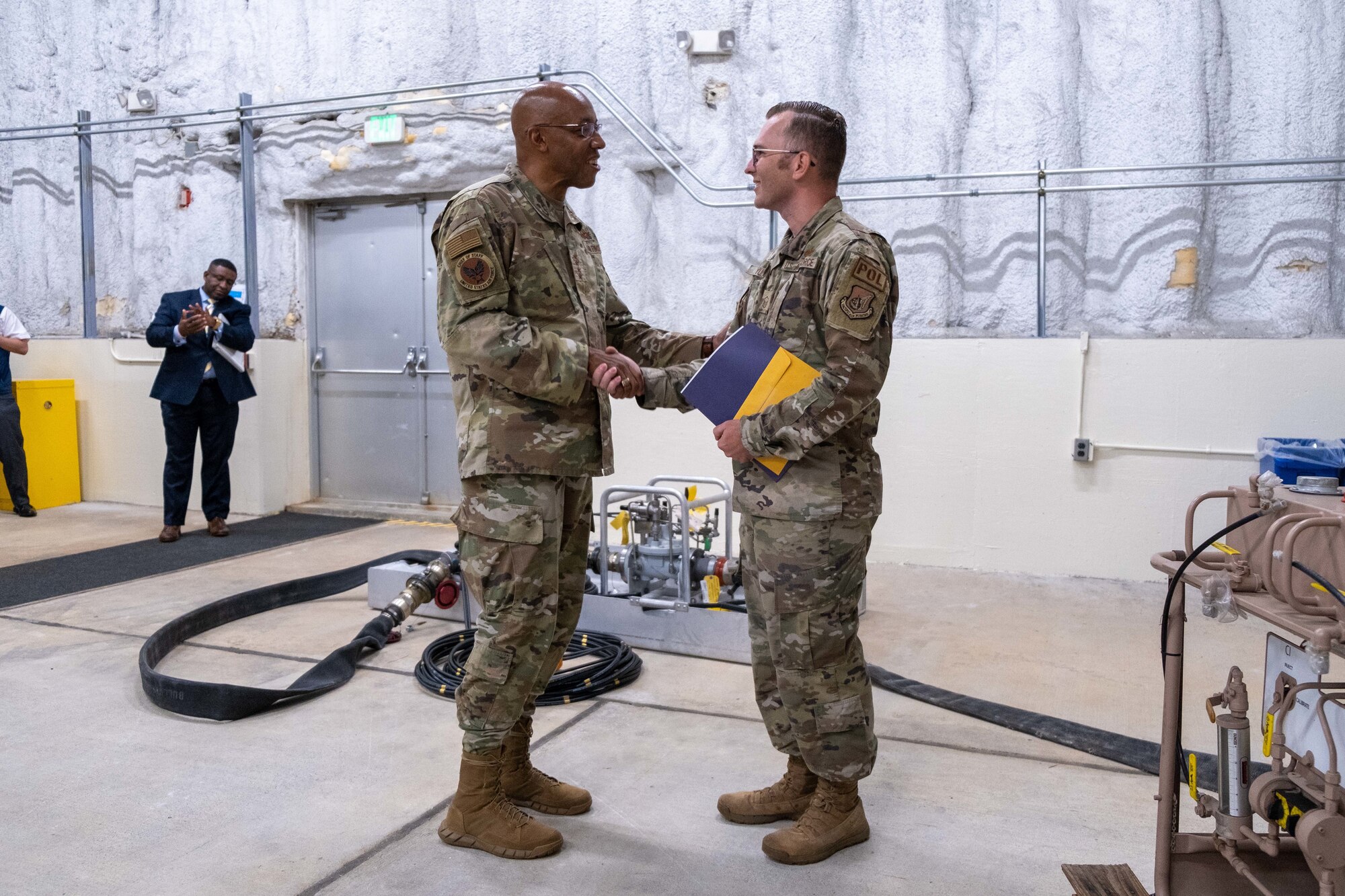 CSAF shakes an Airman's hand.