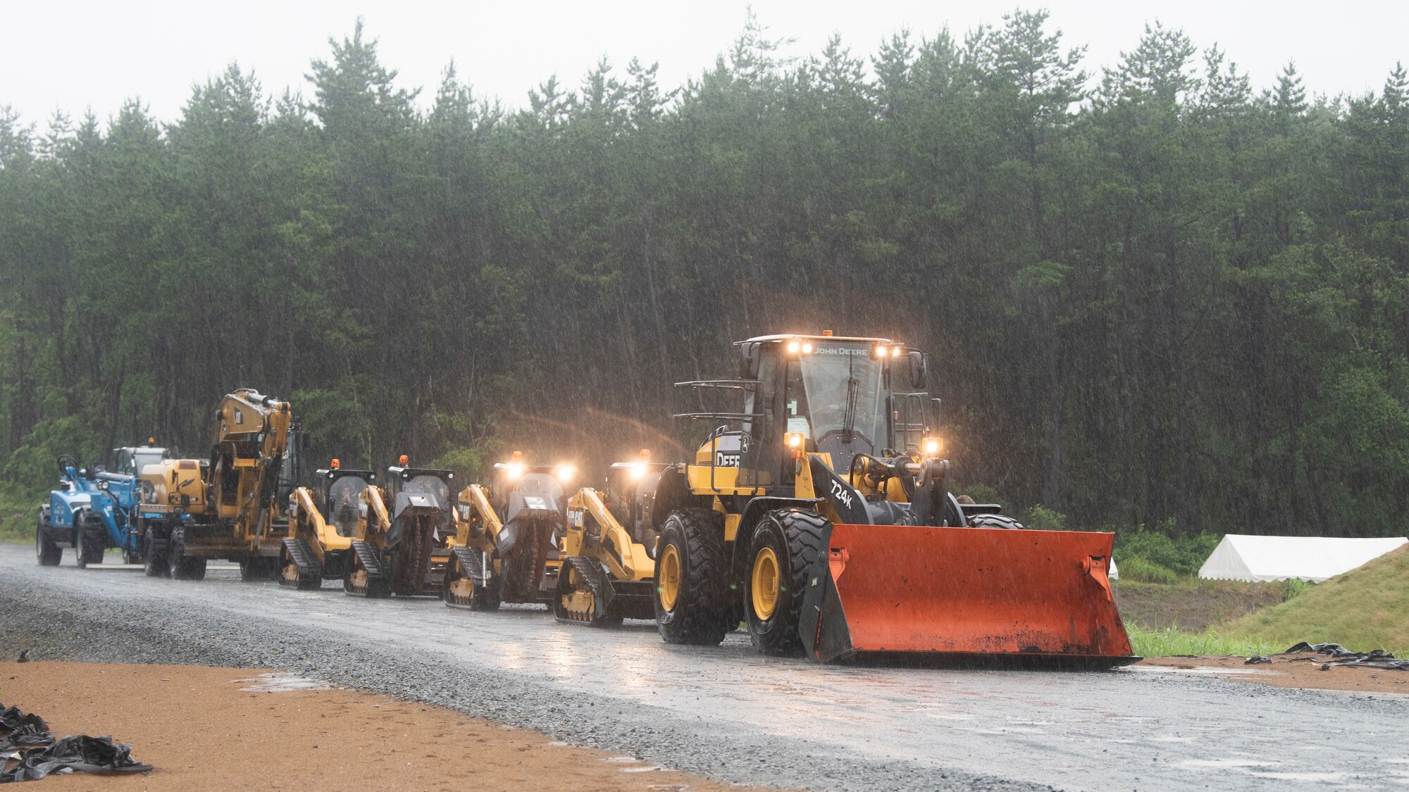 Personel work outside in the rain