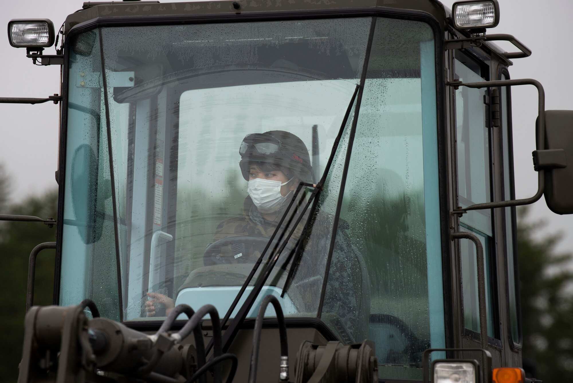 Personel work outside in the rain